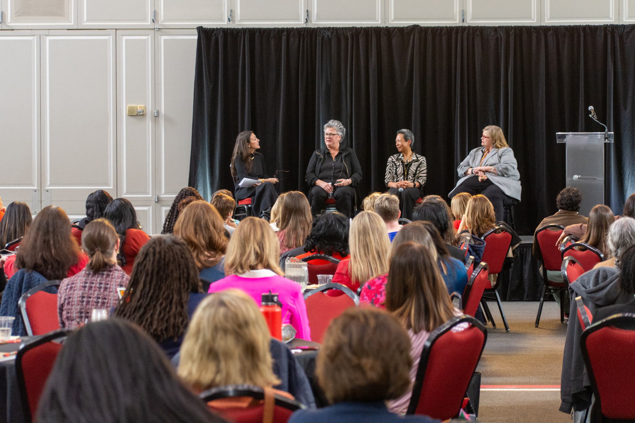 View from the audience of the panel including Cate Luzio, Anne Buckley, Georgina Dodge and Patty Perillo. The room is full!