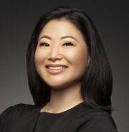 smiling asian woman with shoulder length black hair